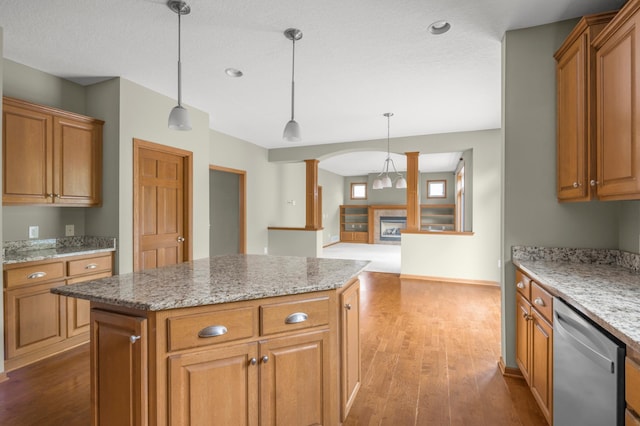 10543 Noble Cir N, Brooklyn Park, MN 55443 - kitchen featuring stainless steel dishwasher, brown cabinetry, dark wood-type flooring, and recessed lighting