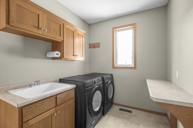 10543 Noble Cir N, Brooklyn Park, MN 55443 - washroom with cabinet space, independent washer and dryer, and baseboards