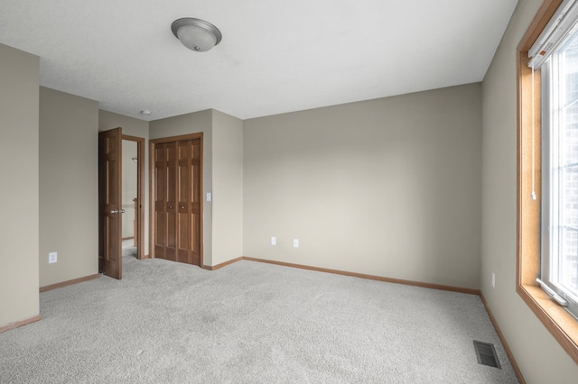 10543 Noble Cir N, Brooklyn Park, MN 55443 - carpeted spare room featuring baseboards