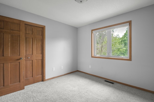 10543 Noble Cir N, Brooklyn Park, MN 55443 - unfurnished bedroom with baseboards and carpet
