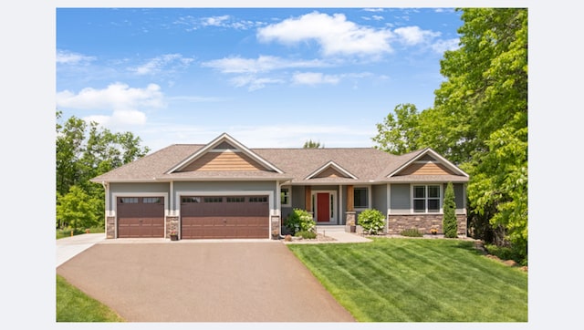 4125 226th Ln NE, East Bethel, MN 55011 - craftsman house featuring asphalt driveway, a front lawn, a garage, and stone siding