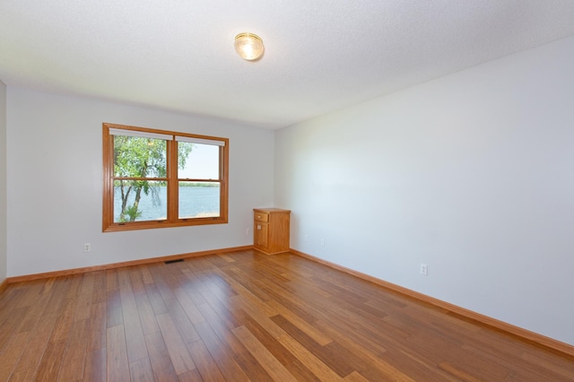 761 Country Lakes Dr, Lino Lakes, MN 55014 - unfurnished room featuring light wood finished floors and baseboards