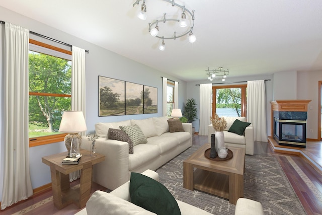 761 Country Lakes Dr, Lino Lakes, MN 55014 - living room with wood finished floors, a high end fireplace, and baseboards