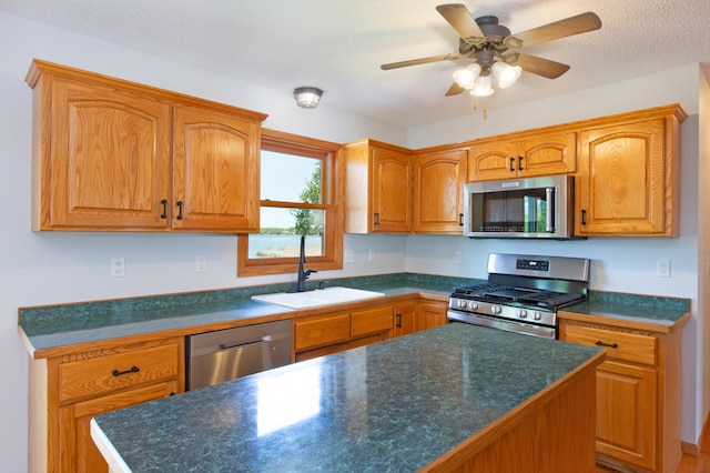 761 Country Lakes Dr, Lino Lakes, MN 55014 - kitchen featuring stainless steel appliances, a sink, and dark countertops