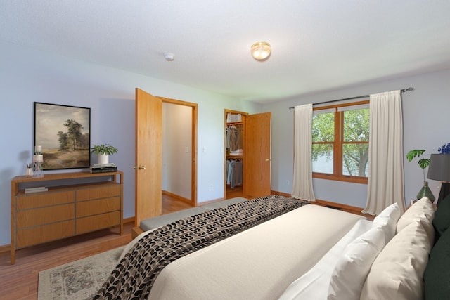 761 Country Lakes Dr, Lino Lakes, MN 55014 - bedroom featuring wood finished floors and baseboards