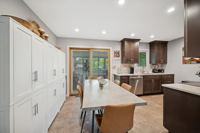 3807 Independence Ave N, New Hope, MN 55427 - kitchen with stainless steel dishwasher, a sink, dark brown cabinetry, recessed lighting, and decorative backsplash