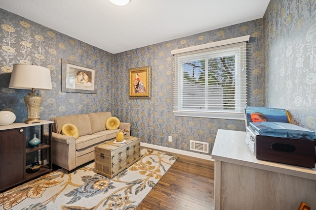 3807 Independence Ave N, New Hope, MN 55427 - living area featuring wood finished floors, baseboards, and wallpapered walls