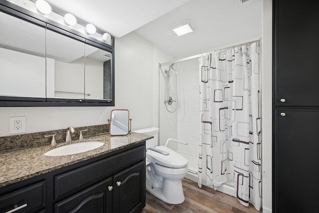 3807 Independence Ave N, New Hope, MN 55427 - bathroom with a shower with shower curtain, wood finished floors, vanity, and toilet