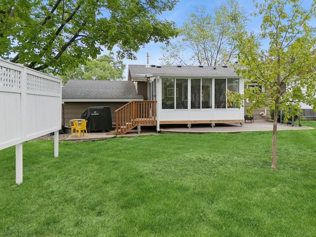 3807 Independence Ave N, New Hope, MN 55427 - back of property with a sunroom, a patio area, and a shingled roof
