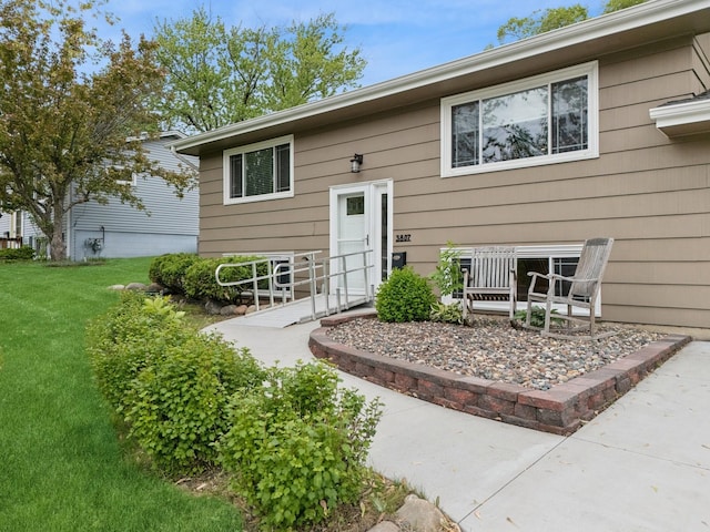 3807 Independence Ave N, New Hope, MN 55427 - doorway to property with a lawn