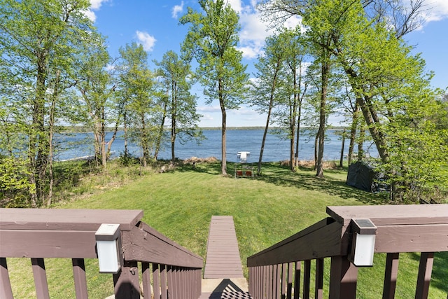 view of grassy yard with a water view