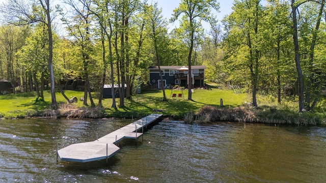 dock with a yard and a water view