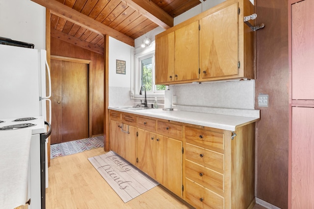 kitchen with a sink, white appliances, wood ceiling, beam ceiling, and light wood-type flooring