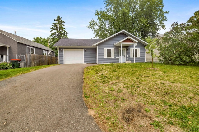 1813 Pine St, Brainerd, MN 56401 - ranch-style house with asphalt driveway and an attached garage
