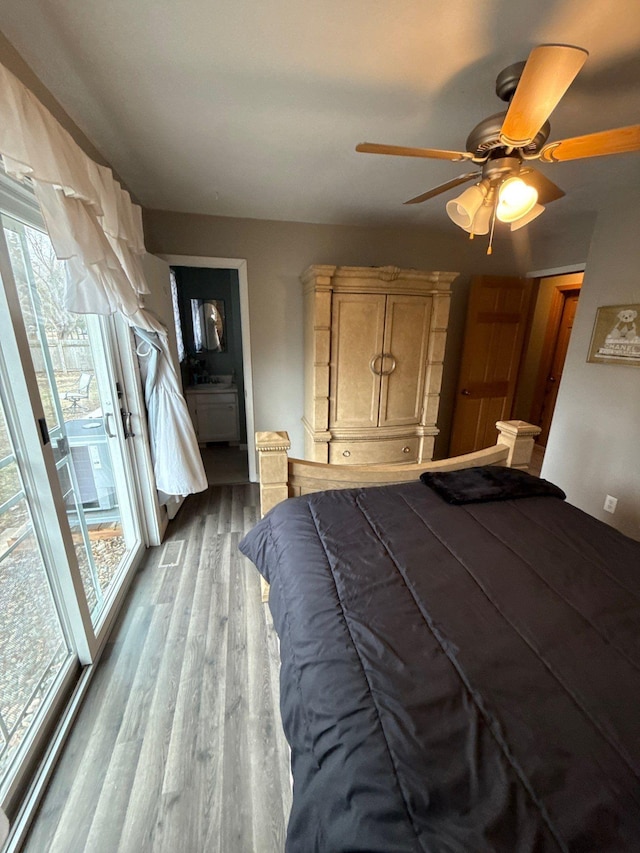 16161 6th St N, Lakeland, MN 55043 - bedroom with wood finished floors, ensuite bathroom, a ceiling fan, and access to outside