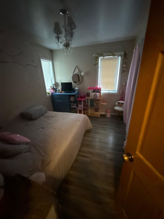 16161 6th St N, Lakeland, MN 55043 - bedroom with wood finished floors and a chandelier