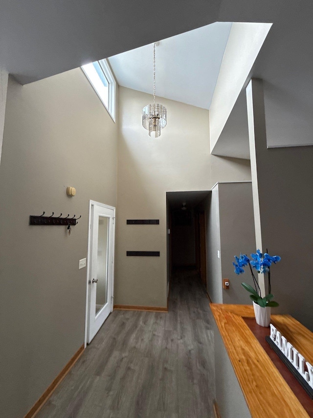 16161 6th St N, Lakeland, MN 55043 - foyer entrance with wood finished floors, a chandelier, a high ceiling, and baseboards