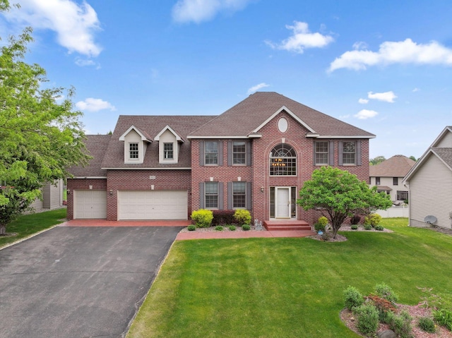 3613 Clare Downs Path, Rosemount, MN 55068 - colonial home with brick siding, asphalt driveway, a front lawn, and a shingled roof