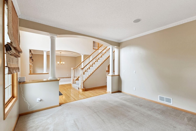 3613 Clare Downs Path, Rosemount, MN 55068 - empty room featuring decorative columns, carpet floors, baseboards, ornamental molding, and arched walkways