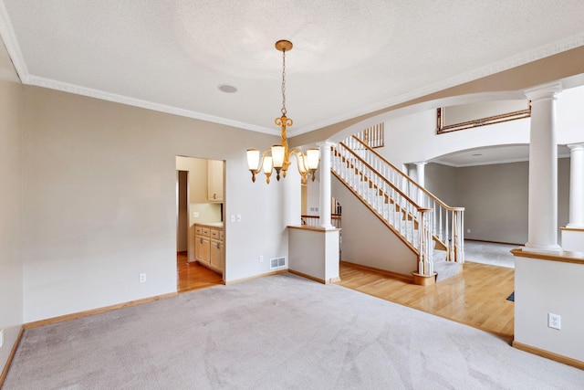 3613 Clare Downs Path, Rosemount, MN 55068 - empty room with light carpet, crown molding, stairs, a chandelier, and baseboards