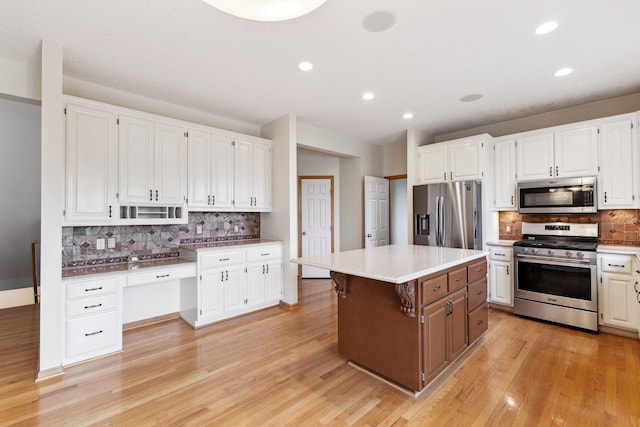 3613 Clare Downs Path, Rosemount, MN 55068 - kitchen with stainless steel appliances, tasteful backsplash, white cabinetry, recessed lighting, and light wood-style flooring