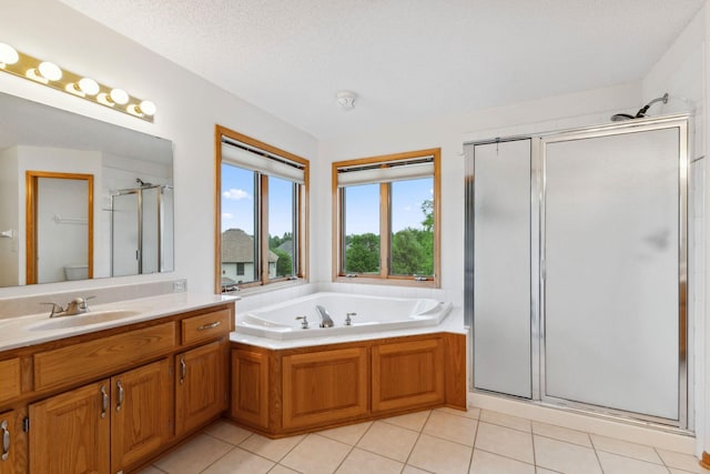 3613 Clare Downs Path, Rosemount, MN 55068 - bathroom with a shower stall, vanity, a bath, tile patterned floors, and a textured ceiling