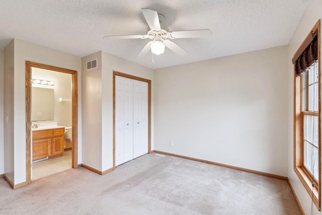 3613 Clare Downs Path, Rosemount, MN 55068 - unfurnished bedroom featuring light carpet, baseboards, a closet, a textured ceiling, and ceiling fan