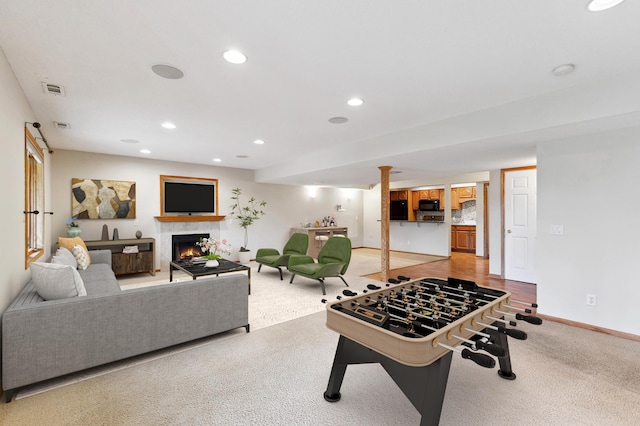 3613 Clare Downs Path, Rosemount, MN 55068 - game room with a lit fireplace, light carpet, baseboards, and recessed lighting
