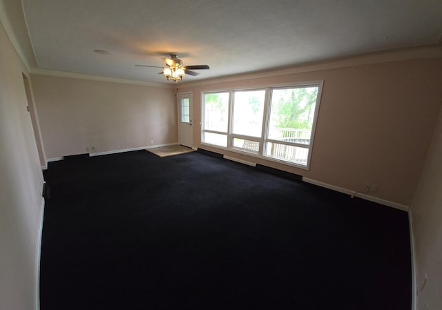 214 Central Ave, Truman, MN 56088 - empty room with baseboards, dark colored carpet, ceiling fan, and crown molding