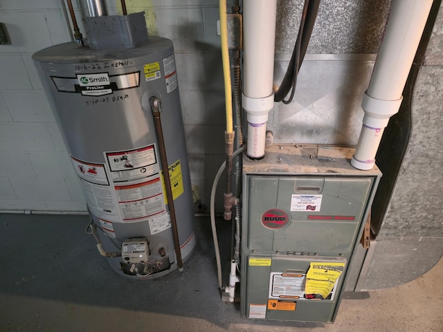 214 Central Ave, Truman, MN 56088 - utility room with water heater and heating unit