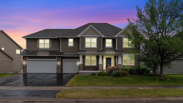 15365 Eagle Creek Way, Apple Valley, MN 55124 - view of front of house featuring a garage, asphalt driveway, a front lawn, and a shingled roof