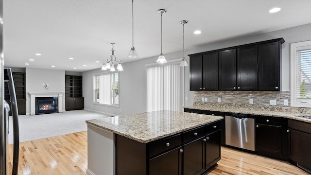 15365 Eagle Creek Way, Apple Valley, MN 55124 - kitchen with dishwasher, light wood-style flooring, recessed lighting, a center island, and decorative backsplash