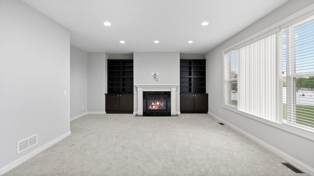 15365 Eagle Creek Way, Apple Valley, MN 55124 - unfurnished living room featuring recessed lighting, carpet flooring, a fireplace with flush hearth, and baseboards