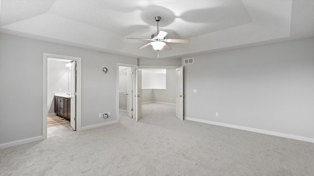 15365 Eagle Creek Way, Apple Valley, MN 55124 - unfurnished bedroom with light carpet, baseboards, a walk in closet, and ensuite bath