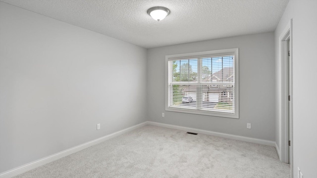 15365 Eagle Creek Way, Apple Valley, MN 55124 - carpeted empty room with a textured ceiling and baseboards