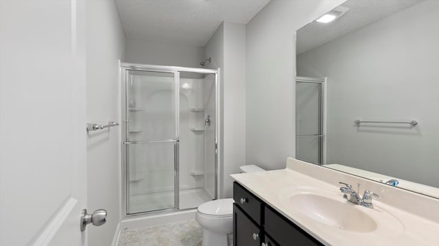 15365 Eagle Creek Way, Apple Valley, MN 55124 - full bath featuring a stall shower, toilet, a textured ceiling, vanity, and tile patterned floors