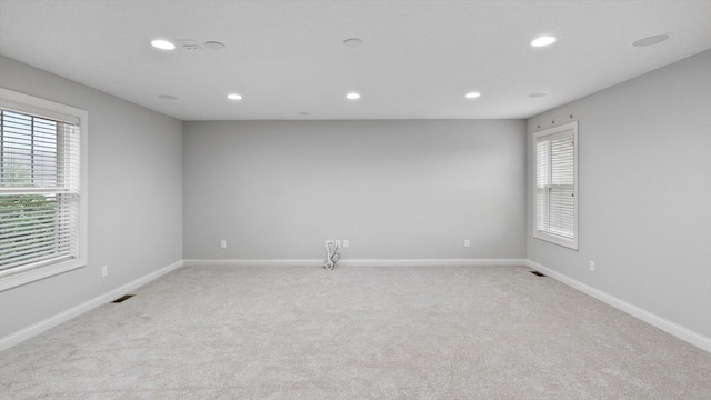 15365 Eagle Creek Way, Apple Valley, MN 55124 - unfurnished room featuring light carpet, recessed lighting, and baseboards
