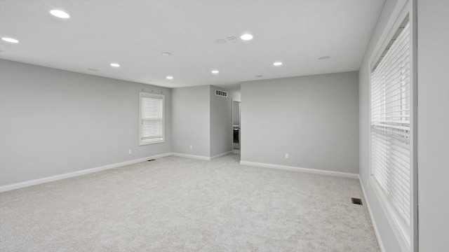 15365 Eagle Creek Way, Apple Valley, MN 55124 - unfurnished room featuring recessed lighting, light carpet, and baseboards