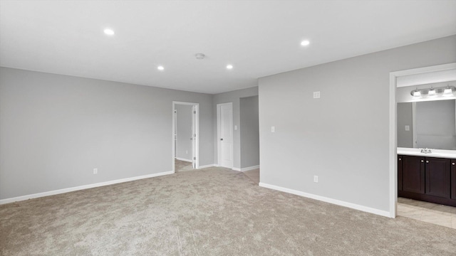 15365 Eagle Creek Way, Apple Valley, MN 55124 - empty room with light carpet, a sink, recessed lighting, baseboards, and a smoke detector