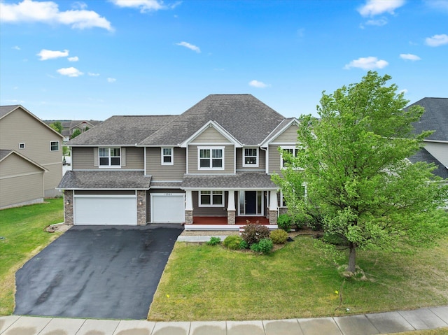 15365 Eagle Creek Way, Apple Valley, MN 55124 - view of front facade featuring a porch, driveway, an attached garage, a front yard, and a shingled roof