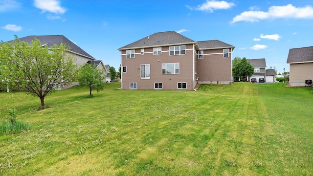 15365 Eagle Creek Way, Apple Valley, MN 55124 - rear view of house with a yard