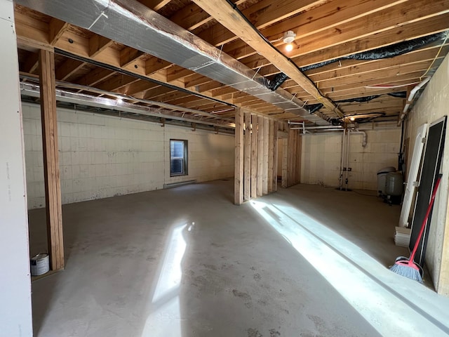 unfinished basement with a water pressure tank