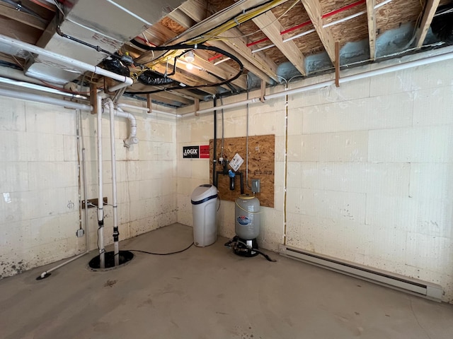 unfinished basement featuring a baseboard heating unit and a water pressure tank