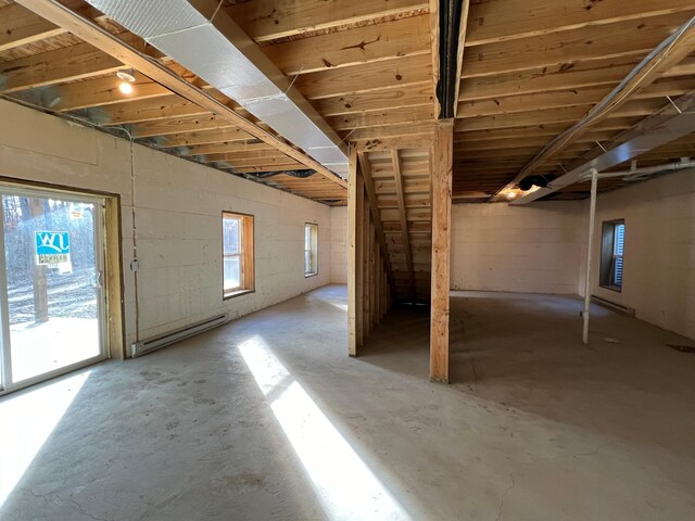 below grade area featuring a baseboard radiator