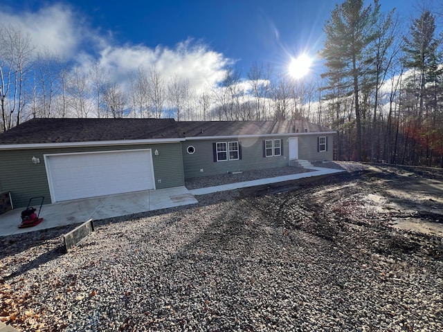single story home featuring an attached garage and driveway