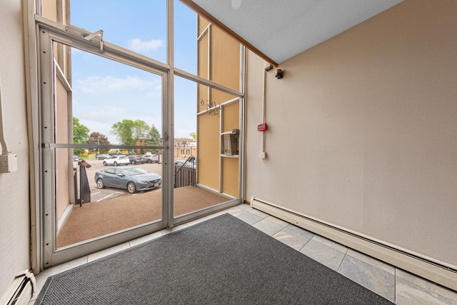5450 Three Points Blvd Unit 623, Mound, MN 55364 - doorway to property with a baseboard heating unit, a baseboard radiator, and a balcony