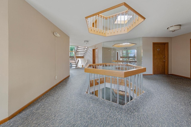 5450 Three Points Blvd Unit 623, Mound, MN 55364 - corridor featuring carpet floors, an upstairs landing, and baseboards