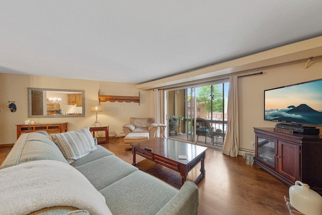 5450 Three Points Blvd Unit 623, Mound, MN 55364 - living room featuring wood finished floors, baseboards, a baseboard heating unit, and a chandelier