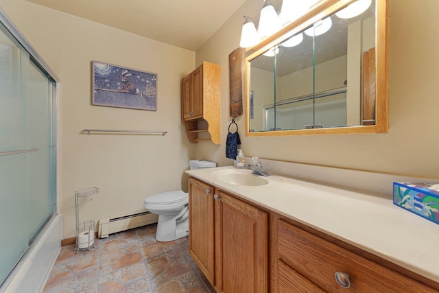 5450 Three Points Blvd Unit 623, Mound, MN 55364 - full bathroom with baseboard heating, toilet, vanity, enclosed tub / shower combo, and baseboards