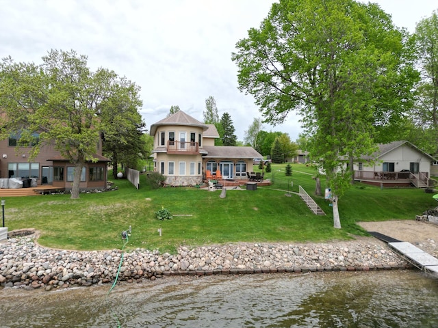 14620 Thomas Rd, Lake Park, MN 56554 - back of house with a deck with water view, a yard, stucco siding, and a patio
